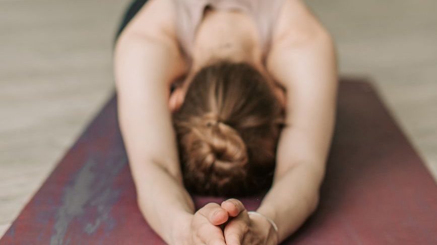 woman using a yoga mat