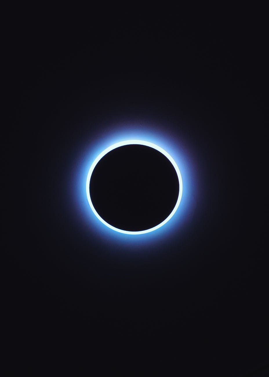 total solar eclipse with purple corona